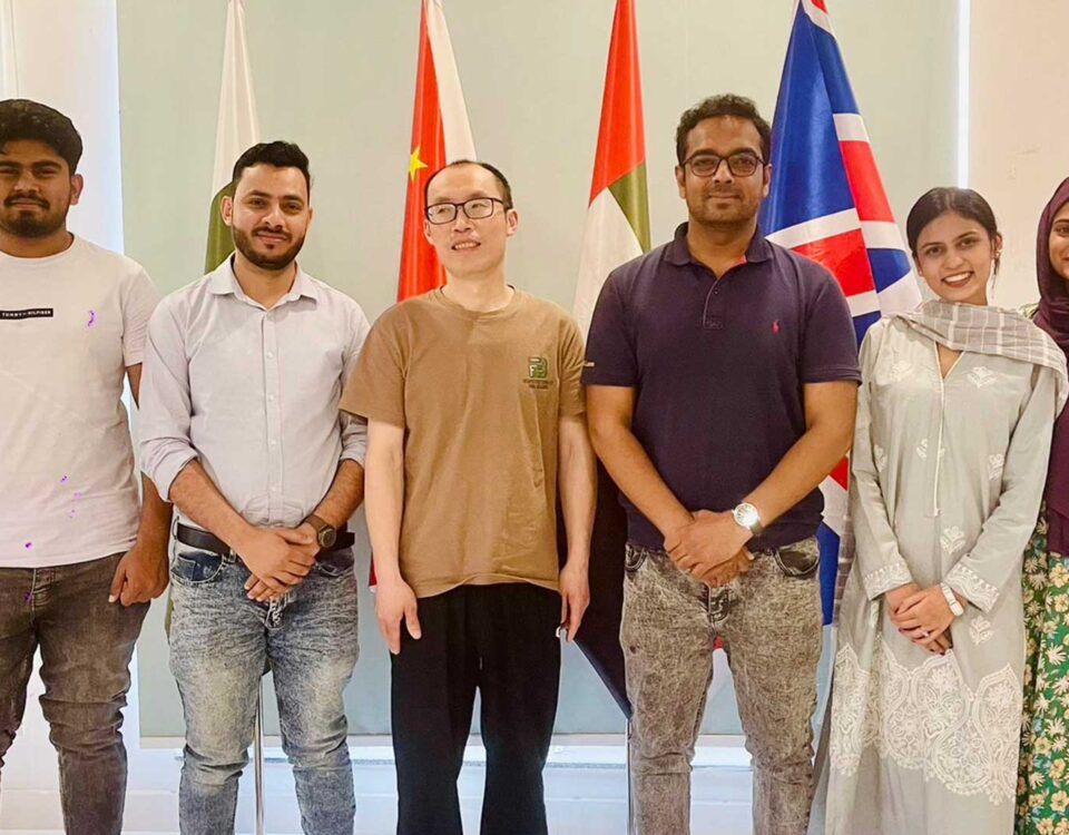 Chinese installation experts working on industrial machinery project